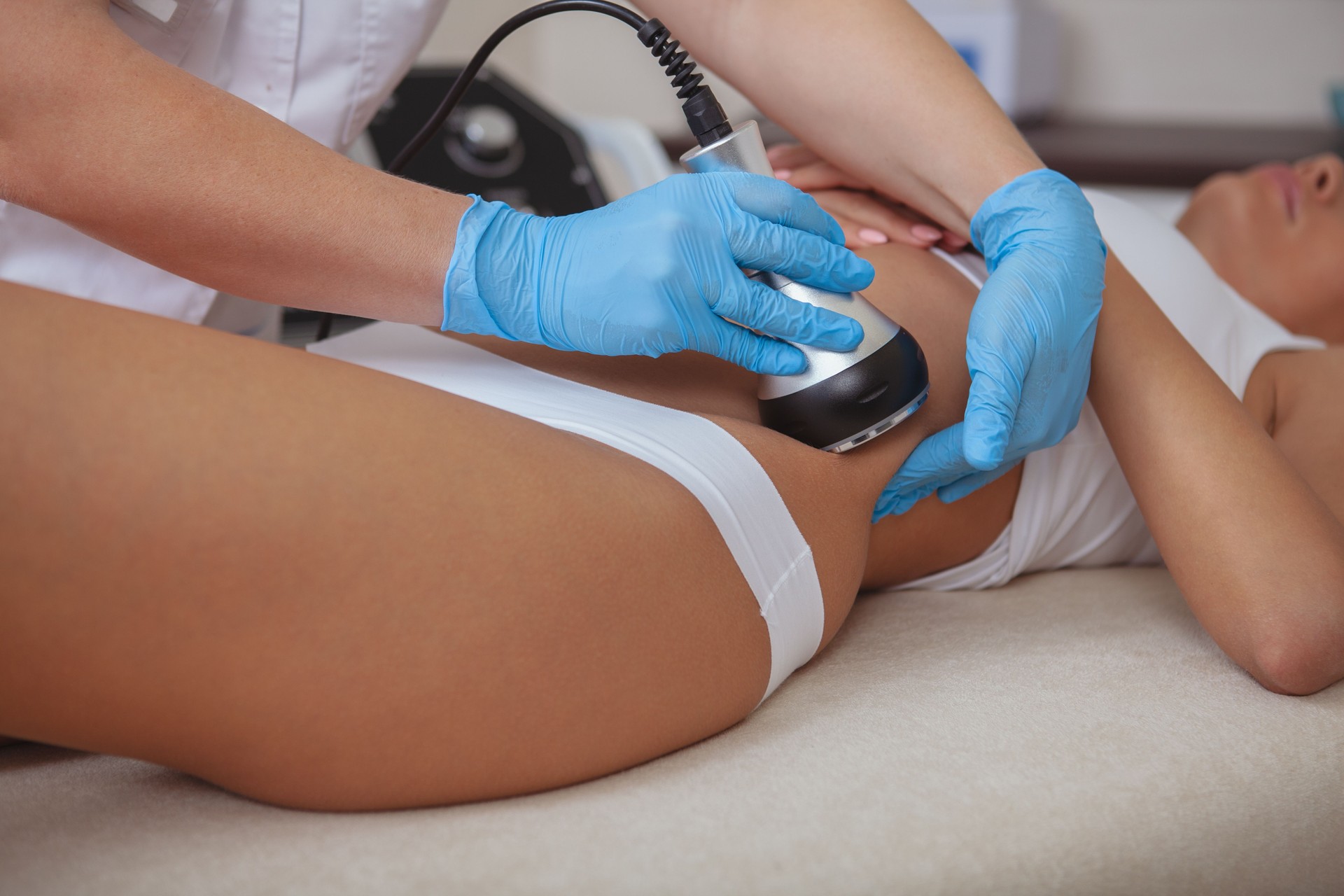 Beautiful woman getting skincare treatment at cosmetology spa center
